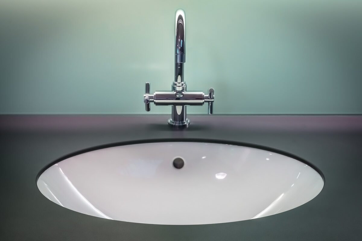 a bathroom vanity with budget-friendly skincare bottles next to cult favorites