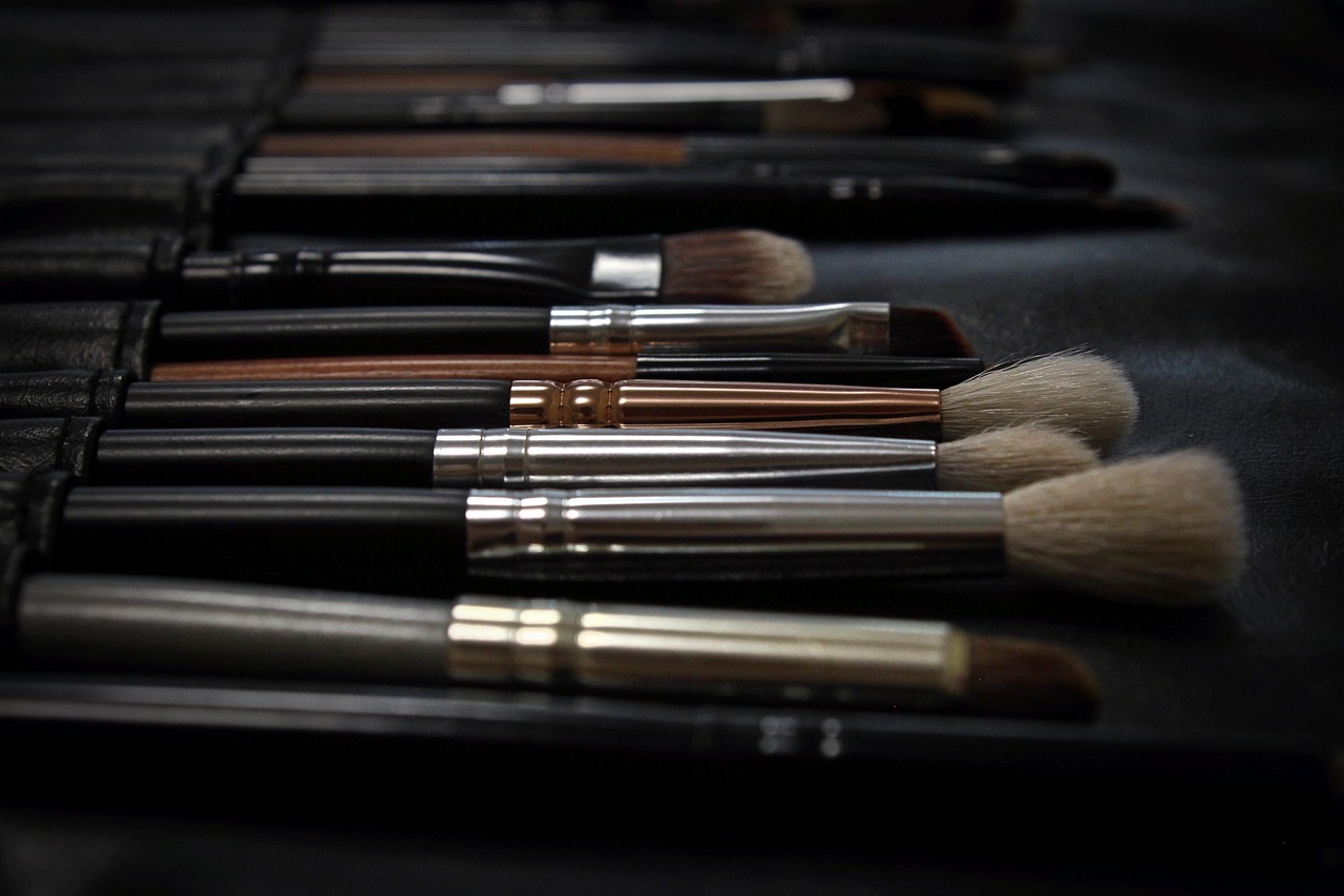 viral beauty dupes - a close-up of a sleek makeup palette with viral dupes side by side